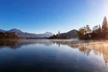 Bled lake in autumn morning, scenic view of Bled Island and Bled castle