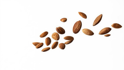 Almonds fall in pile on light gray background. Creative concept of floating healthy snacks. Levitation of nuts. Close-up. Copy space.