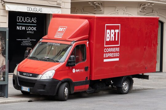 Red Iveco Daily commercial vehicle of BRT delivery company in Bologna, Italy