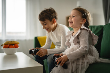 brother and sister siblings boy and girl play video game console