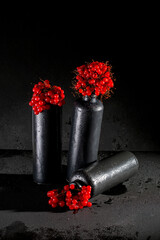 Still life with viburnum red in dark vases