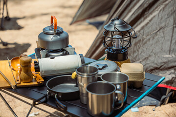 A picturesque morning at the campsite, essential cooking equipment, kettle, pot, pan, gas stove,...
