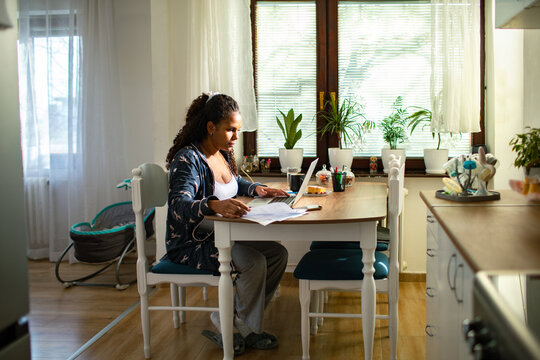 Young Woman Working From Home On Laptop