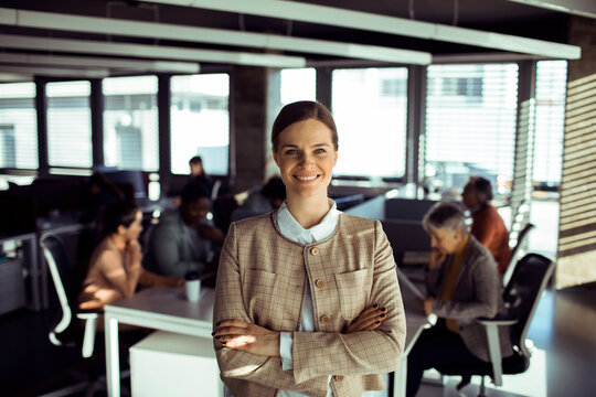 Portrait of a smiling young businesswoman at modern office
