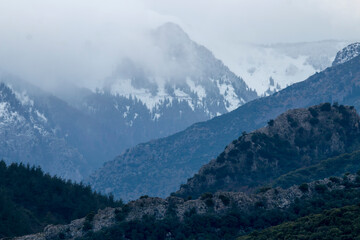 Pindus mountains in Greece with snow and fog. beautiful destination for travel.