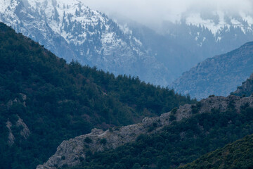 Fototapeta premium Pindus mountains in Greece with snow and fog. Beautiful destination for travel.