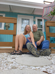 senior adult couple sitting on porch
