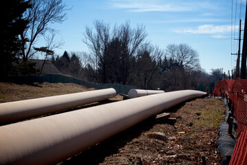 Natural gas liquids pipeline construction in a residential neighborhood using horizontal directional drilling.