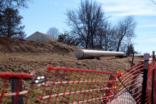 Natural gas liquids pipeline construction in a residential neighborhood using horizontal directional drilling.