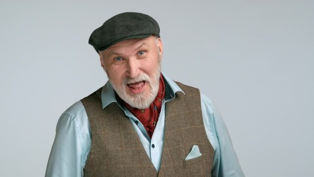Middle-aged man in stylish tweed waistcoat, playfully smirking with tongue out. His elegant and whimsical pose against a light grey background adds a unique, engaging charm to the portrait. 8K RAW
