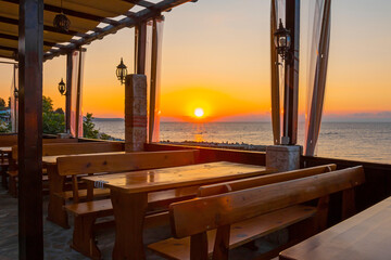 Outdoor cafes and restaurants on the Black sea coast in old town of Nessebar. Sea resort in Bulgaria