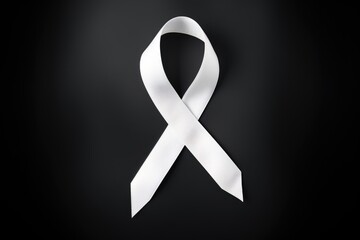 lung cancer ribbon, white ribbon on black background, a symbol of the fight against lung cancer