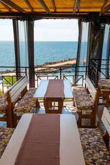 Charming restaurant overlooking the Black Sea in the town of Nesebar, Bulgaria. A sunny and beautiful day.
