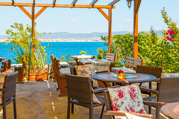 Charming restaurant overlooking the Black Sea in the town of Nesebar, Bulgaria. A sunny and beautiful day.