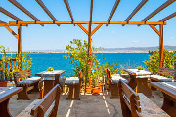 Charming restaurant overlooking the Black Sea in the town of Nesebar, Bulgaria. A sunny and beautiful day.