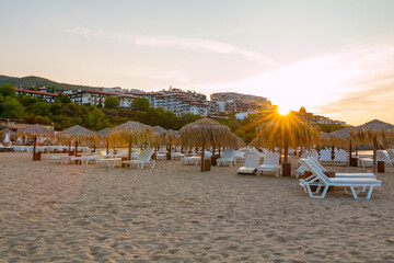 Sunrise, morning on the beach in the town of Saint Vlas, Bulgaria. An empty beach bathed in sunlight.