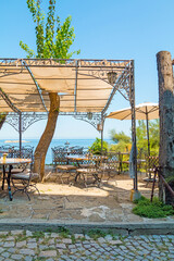Charming restaurant overlooking the Black Sea in the town of Nesebar, Bulgaria. A sunny and beautiful day.