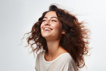 long-haired brunette girl smiling on a white background