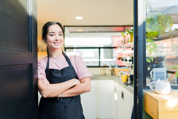 Fototapeta na wymiar Attractive woman entrepreneur opening her restaurant
