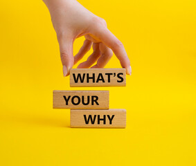 What is Your Why symbol. Concept words What is Your Why on wooden blocks. Businessman hand....