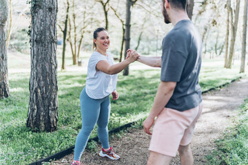 A beautiful, overweight female and her friend enjoy to jogging in the park, then take time to...