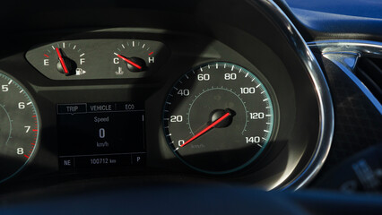 car speedometer in sunlight. engine temperature is low