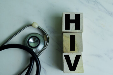 Concept of The wooden Cubes with the word HIV on wooden background.
