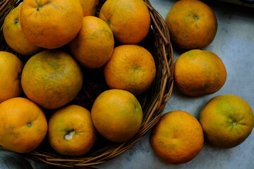 Close up shot of Kinnow Oranges in wooden basket © ravinepz