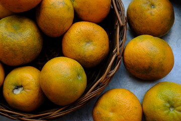 Close up shot of Kinnow Oranges in wooden basket © ravinepz