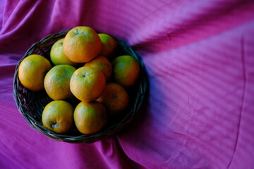 Close up shot of Kinnow Oranges in wooden basket © ravinepz