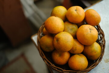 Close up shot of Kinnow Oranges in wooden basket © ravinepz