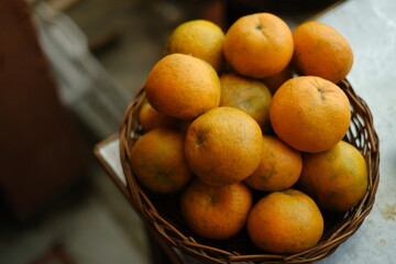 Close up shot of Kinnow Oranges in wooden basket © ravinepz