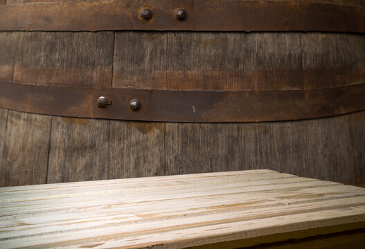 background of barrel and worn old table of wood. High quality photo. High quality photo