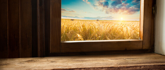 Empty wooden table with wheat field background, product display montage. High quality photo