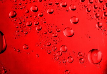 Ice cold red glass with water drops
