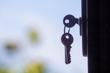 Key in a lock with a blurred background, symbolizing security and access