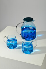 Pour water into a blue glass