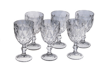 Set of empty gray crystal glasses isolated on white background