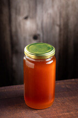 Glass jar of honey. Fresh honey in the jar.
