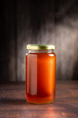 Glass jar of honey. Fresh honey in the jar.