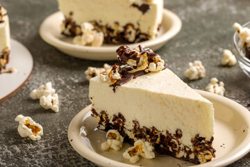 Cottage cheese cake with popcorn. Dark background
