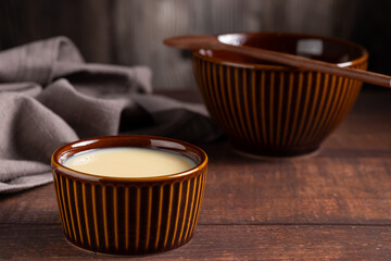 Fresh condensed milk in the bowl.