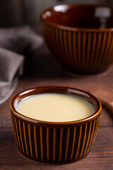 Fresh condensed milk in the bowl.