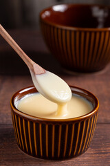 Fresh condensed milk in the bowl.