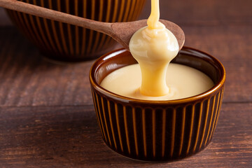 Fresh condensed milk in the bowl.