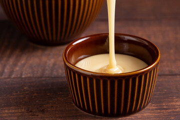 Fresh condensed milk in the bowl.