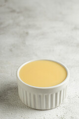 Fresh condensed milk in the bowl.