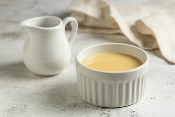 Fresh condensed milk in the bowl.