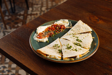 Appetizing tortilla with salsa sauce in restaurant - 705234865