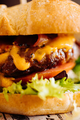 Appetizing burger with fresh tomatoes and lettuce - 705237422